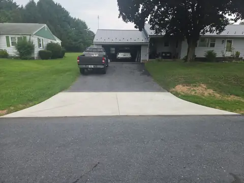 Concrete driveway apron meeting the street