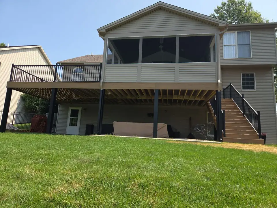 Screened porch built on a composite deck with stairs